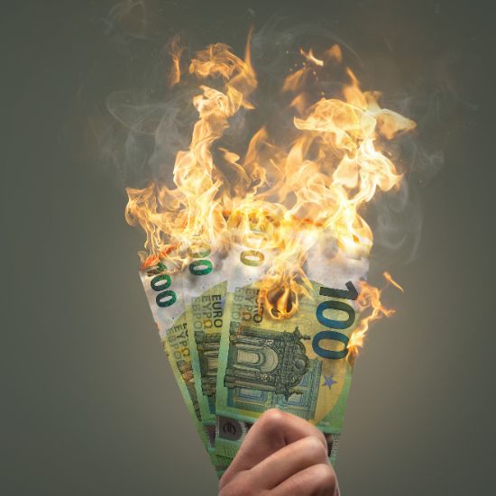 A fist full of dollars burning.